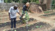 Gitte and Mr. Yona caring for the garden that provides food for the pregnant women.